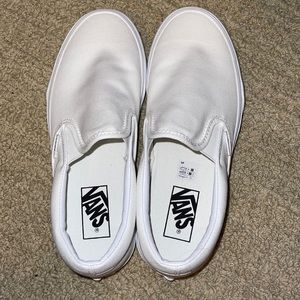 Brand new white slip on vans. Never worn.